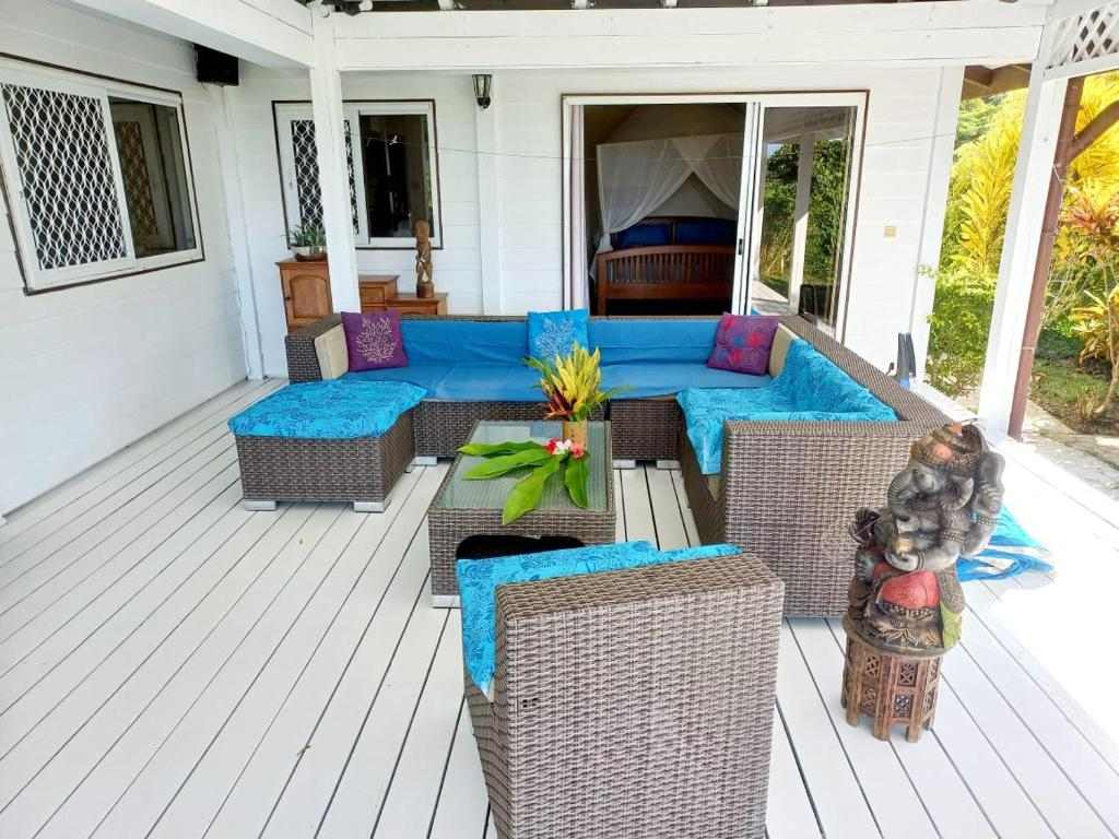 Covered terrace with lounge seating at Villa MERAHI